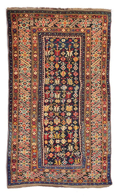 Appraisal: A CAUCASIAN CHICHI RUG the central dark blue ground panel