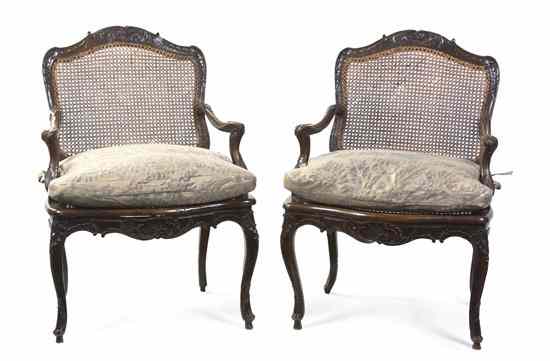 Appraisal: A Pair of Regence Walnut Fauteuils Bourdeaux circa having a