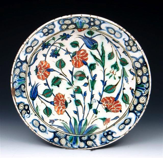 Appraisal: AN EARLY TH CENTURY IZNIK POTTERY DISH decorated in polychrome