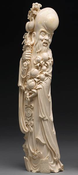 Appraisal: An ivory Shoulao holding a peach branch th Century Seen