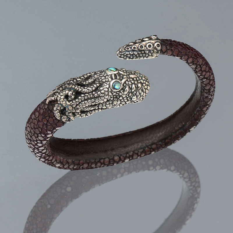 Appraisal: STERLING SILVER SHAGREEN SINGLE COIL SNAKE BRACELET The sterling and