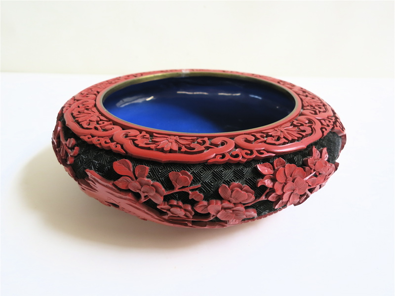 Appraisal: CHINESE CINNABAR STYLE BOWL having red raised carving on black