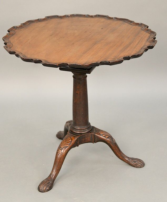 Appraisal: Chippendale mahogany tip table having shaped pie crust top on