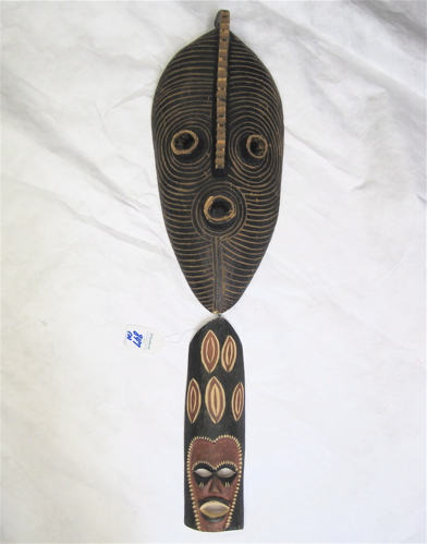 Appraisal: TWO HAND CARVED WOOD AFRICAN MASKS from Zimbabwe The larger