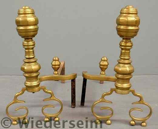 Appraisal: Large pair of brass andirons th c with faceted tops