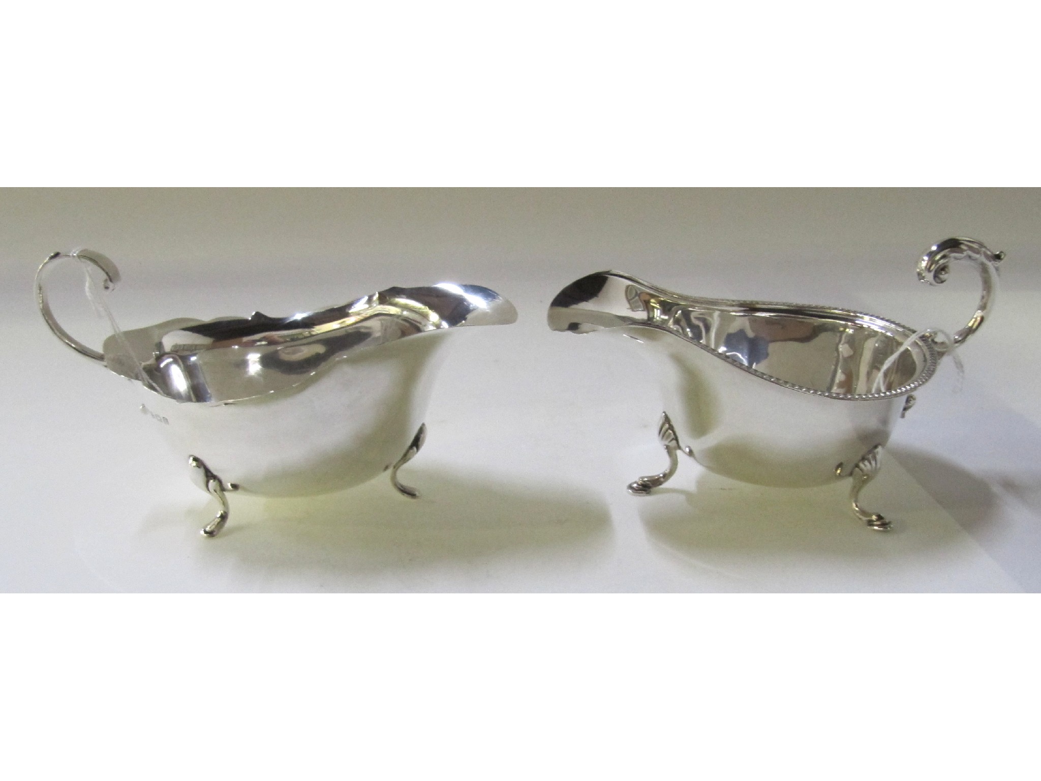 Appraisal: A lot comprising two silver sauceboats Chester Birmingham