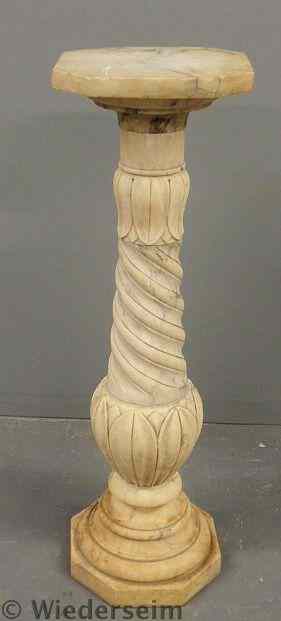 Appraisal: Marble pedestal with a rotating top swirl carved shaft and