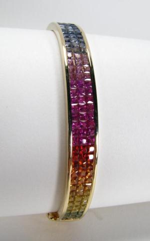 Appraisal: Lady's invisible set multicolored sapphire and k yellow gold bangle