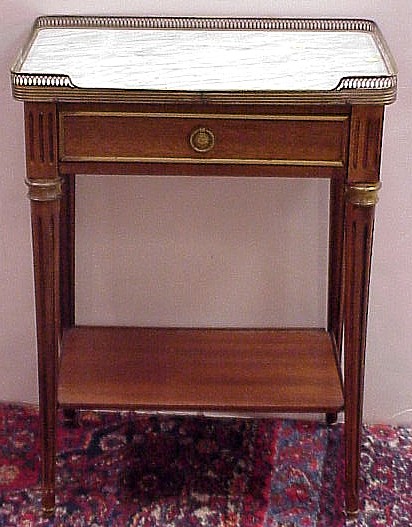 Appraisal: Marble top French single drawer stand brass gallery reeded tapered