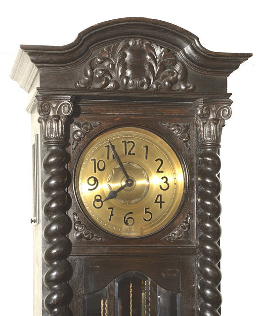 Appraisal: AN EARLY TH CENTURY DARK OAK LONGCASE CLOCK the circular