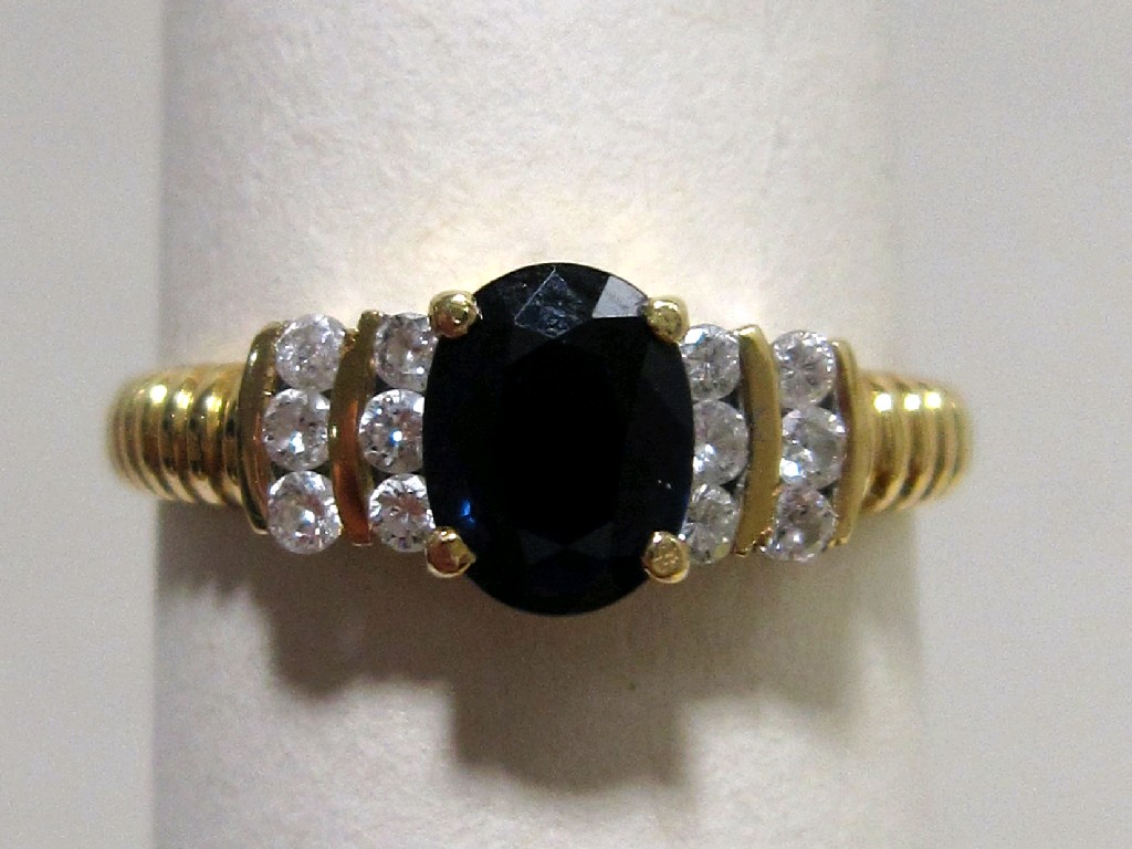 Appraisal: Eighteen carat gold sapphire and diamond set dress ring