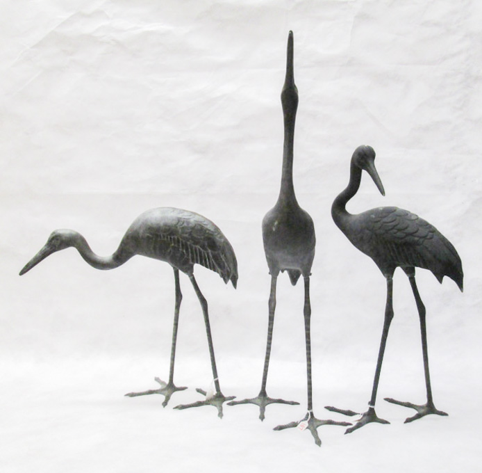 Appraisal: THREE BRONZE HERONS in various positions measuring to tall