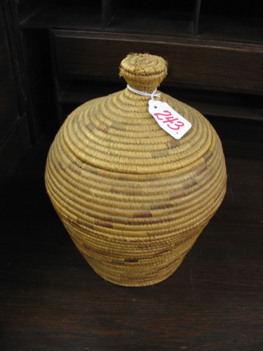 Appraisal: AN ALEUT ESKIMO INDIAN COVERED BASKET the coiled basket with