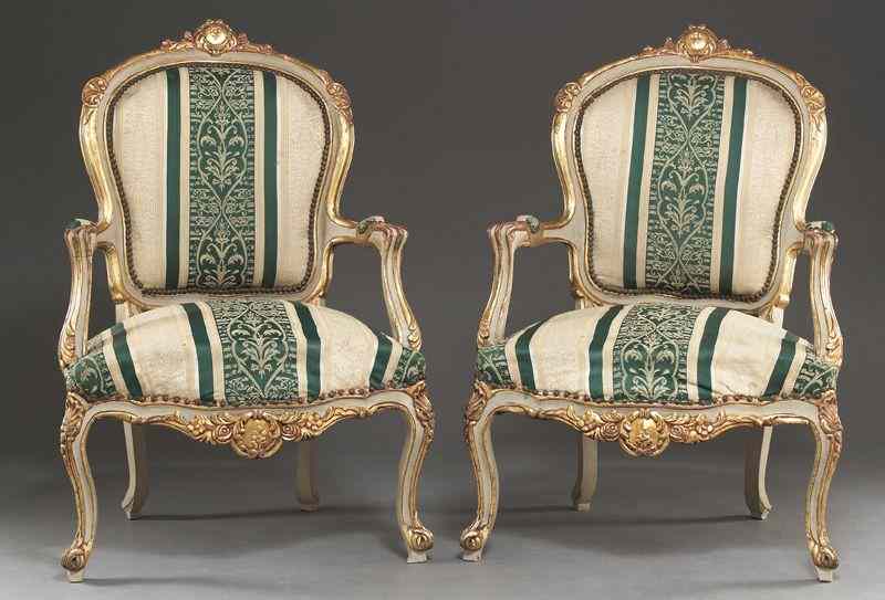 Appraisal: Pr Italian creme peinte and parcel gilt armchairshaving a shield