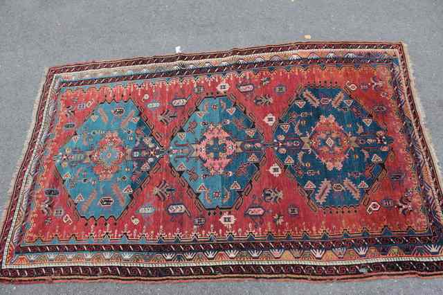 Appraisal: A CAUCASIAN DERBEND RUSTGROUND RUG decorated a central pattern of