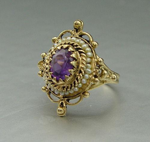 Appraisal: K AMETHYST SEED PEARL RING K yellow gold ring contains