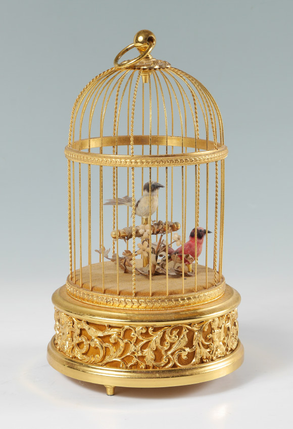 Appraisal: REUGE DOUBLE CAGED BIRD SINGING AUTOMATON Brass cage with applied