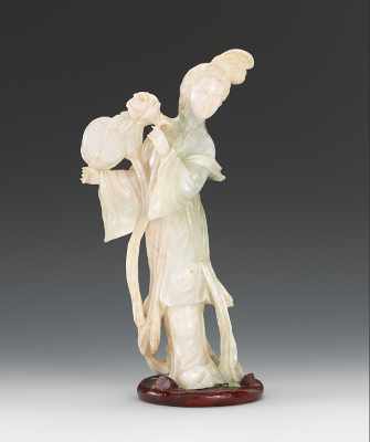 Appraisal: A Carved Jadeite Maiden with Fan and Flower Carved jadeite