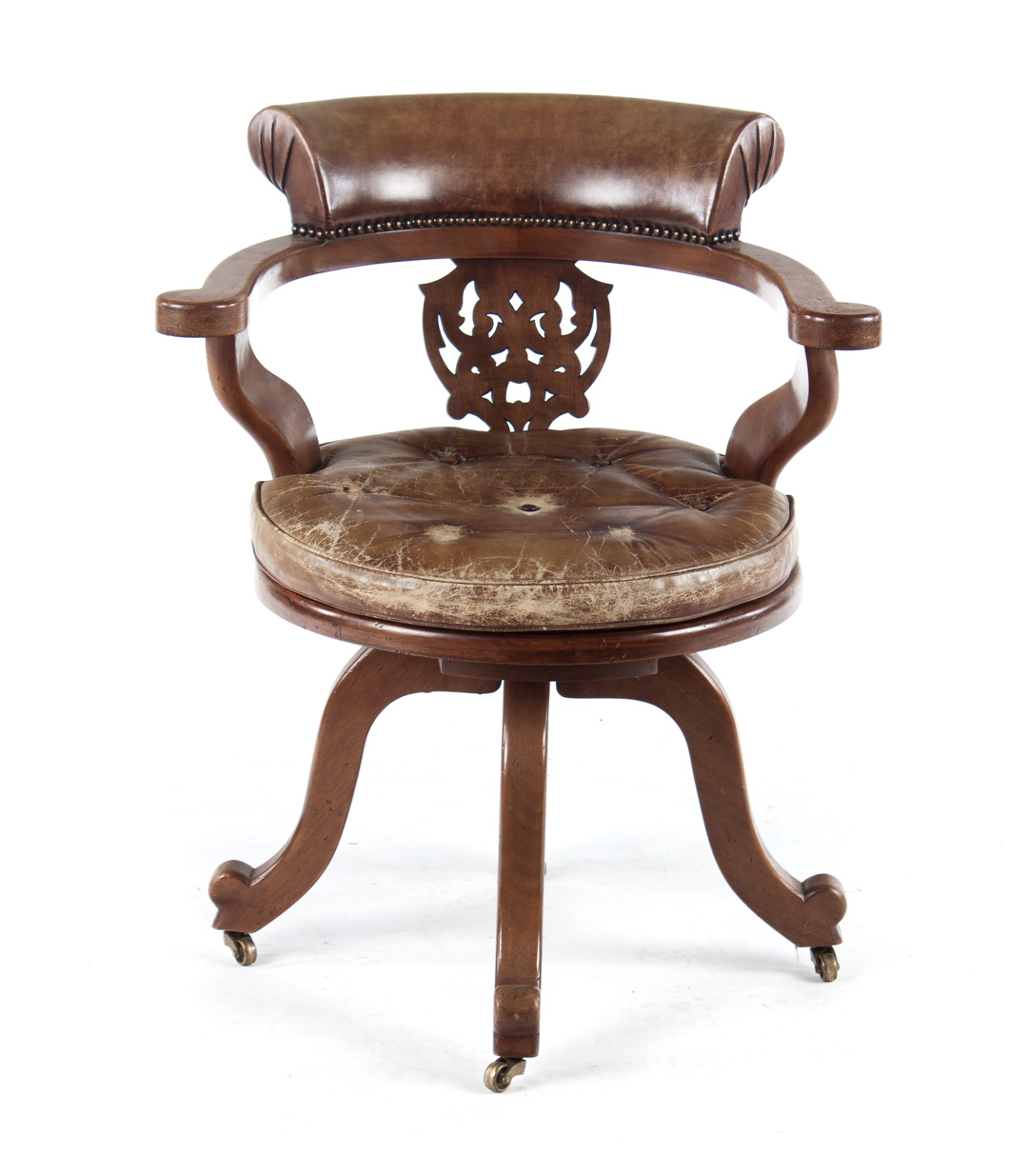 Appraisal: English walnut leather upholstered swivel armchair th century Victorian style