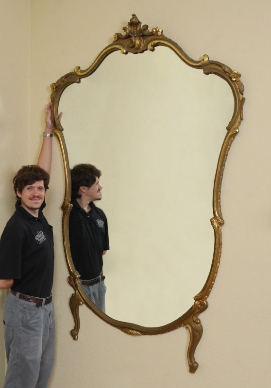 Appraisal: ORNATELY CARVED FRENCH PIER MIRROR In the rococo style shaped