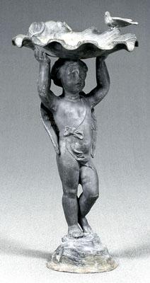 Appraisal: Figural lead birdbath winged putto with raised arms holding clamshell