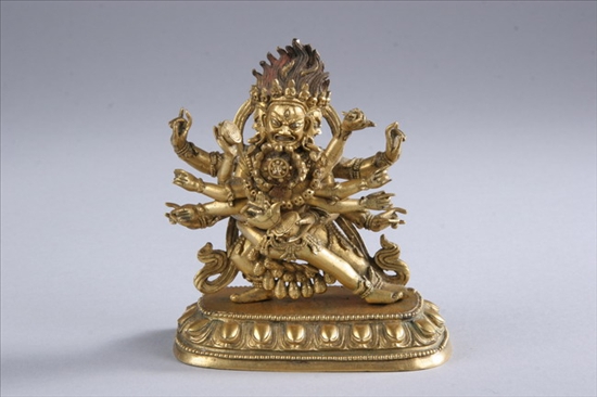 Appraisal: TIBETO-CHINESE GILT- BRONZE FIGURE OF MAHAKALA AND CONSORT th century