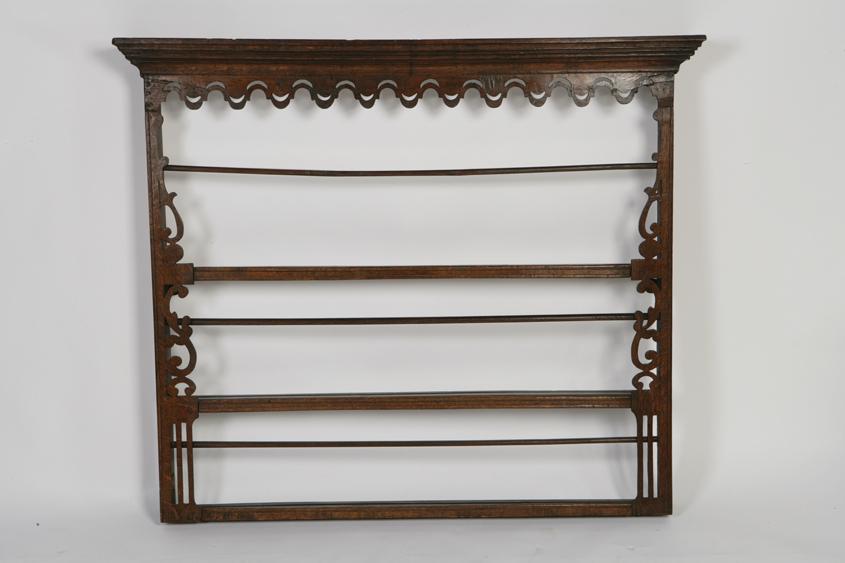 Appraisal: A GEORGE III OAK DELFT RACK with a moulded cornice