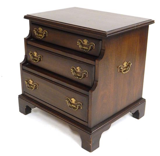 Appraisal: Small mahogany chest th C three staggered drawers with brass