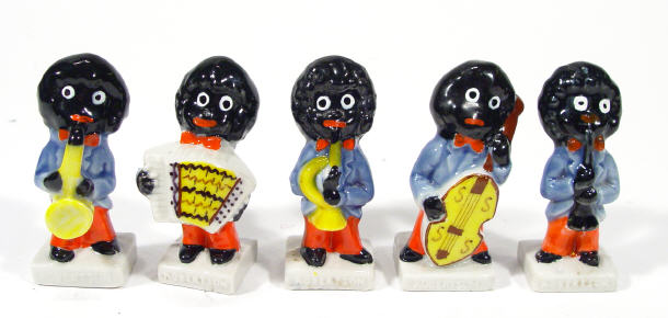 Appraisal: Five hand painted Wade golliwog musician band members each cm