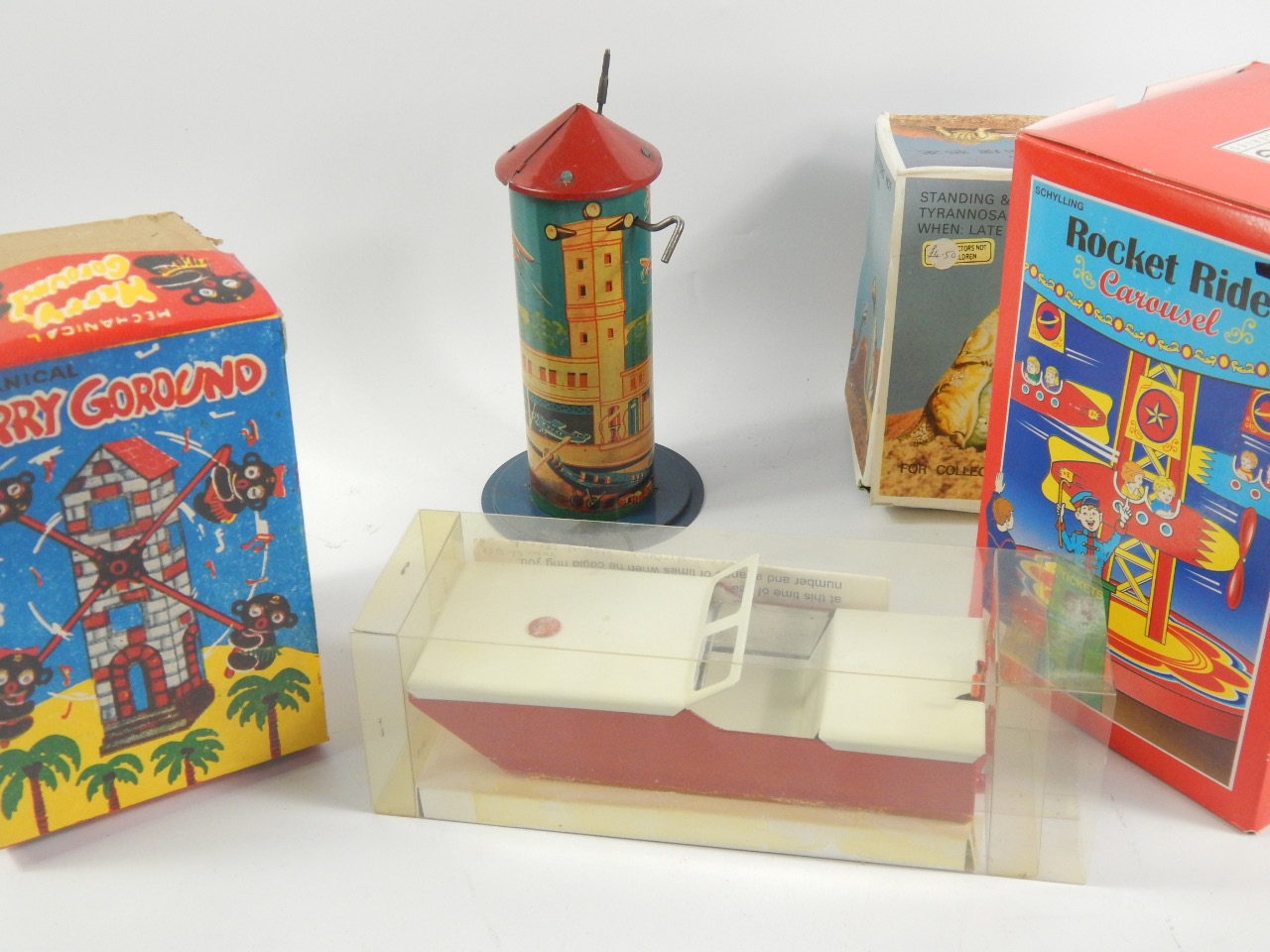 Appraisal: A collection of modern tin plate toys including merry-go-rounds box