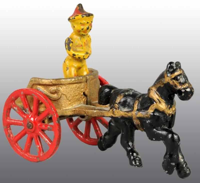 Appraisal: Cast Iron Gold Chariot Toy with Clown Description The chariot