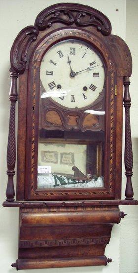 Appraisal: An American wall clock in a walnut case fitted an