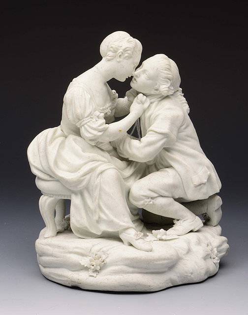 Appraisal: A DERBY WHITE BISCUIT GROUP of two lovers on a