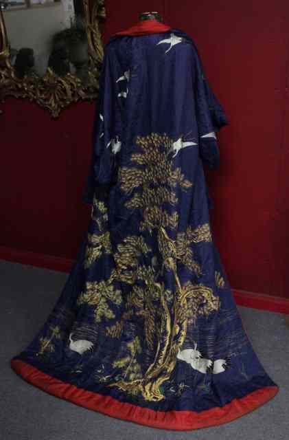 Appraisal: A Japanese robe with cowl decorated with prunus branches and