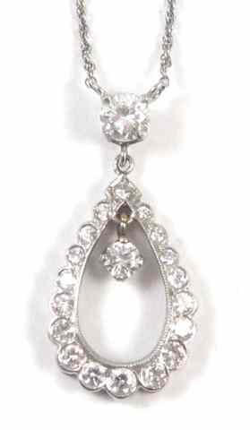 Appraisal: DIAMOND AND WHITE GOLD PENDANT NECKLACE Set between two equal