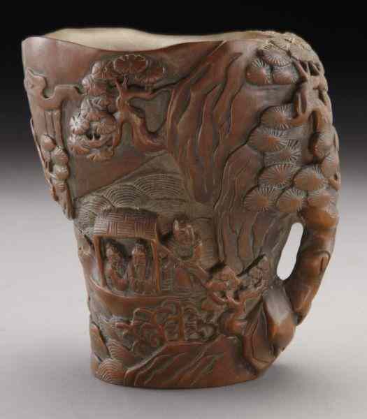 Appraisal: Chinese carved boxwood libation cupdepicting figures in a landscape ''H