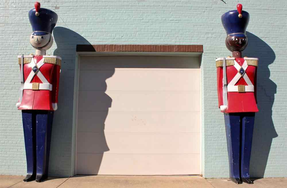 Appraisal: TWO MONUMENTAL 'BABES IN TOYLAND' STYLE FIBERGLASS HOLIDAY TOY SOLDIERS