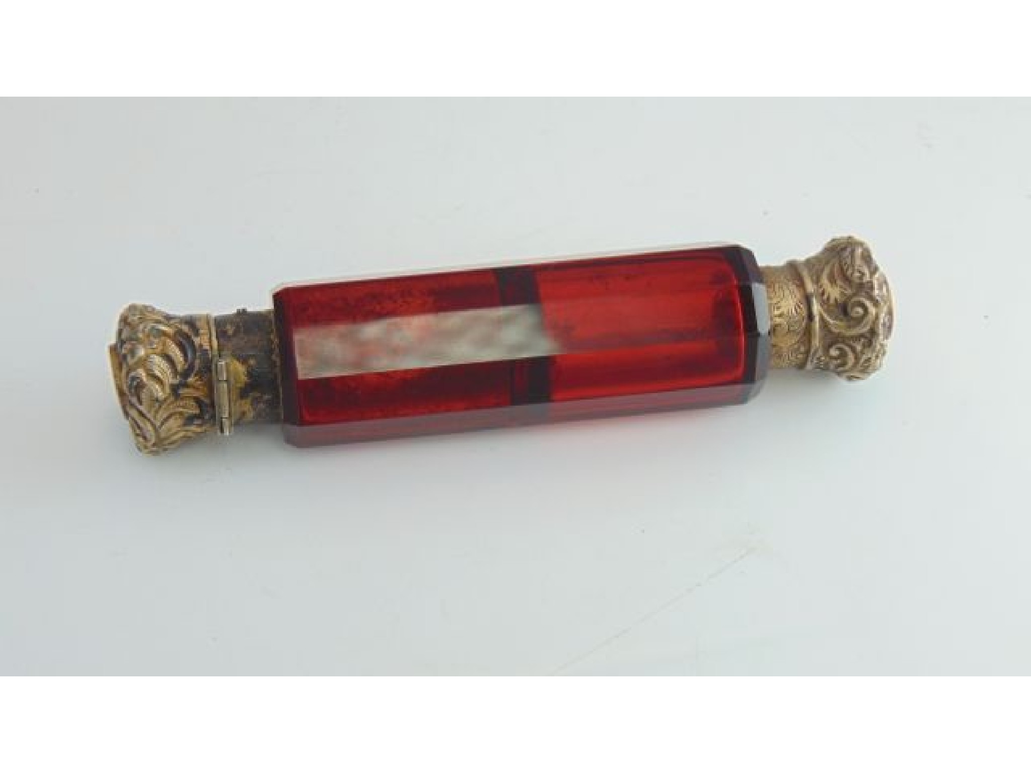 Appraisal: A Victorian cranberry glass double-ended scent bottle with gilt hinged