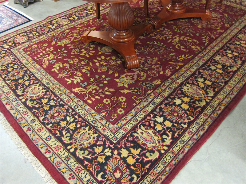 Appraisal: HAND KNOTTED ORIENTAL CARPET red field Indo-Sarouk ' x '