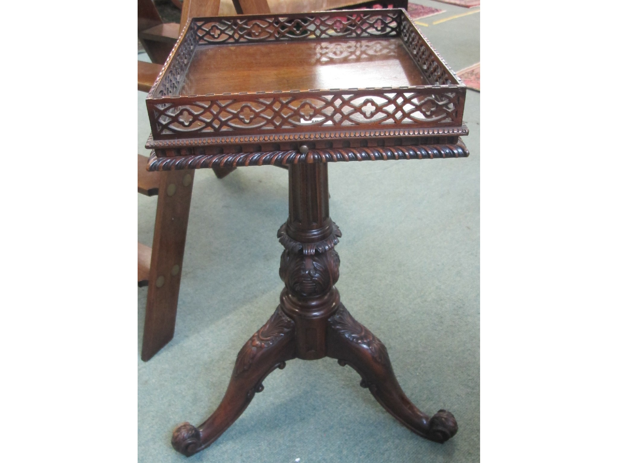 Appraisal: A th Century mahogany plant stand on a floral tripod