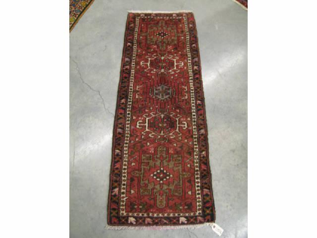 Appraisal: Heriz Persian Handmade Rug geometric designs on burgandy field '