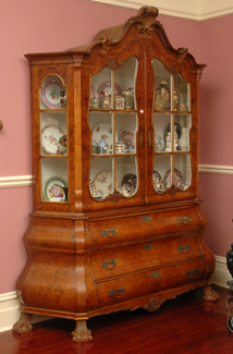 Appraisal: A DUTCH BURR WALNUT VITRINE The shaped cornice above two