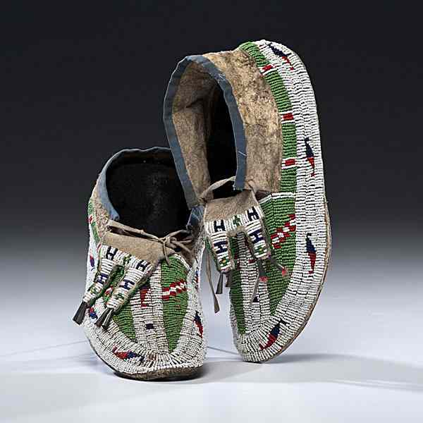 Appraisal: Sioux Beaded Hide Moccasins sinew-sewn and beaded using colors of