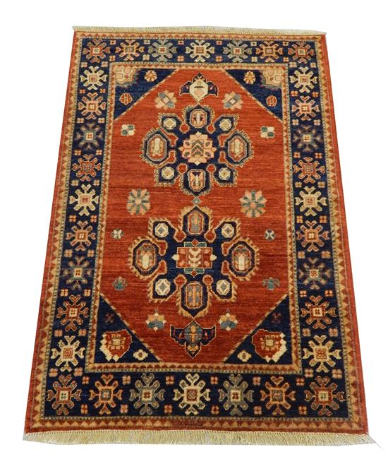 Appraisal: RUG Uzbek Kazak '' x '' brick red field with