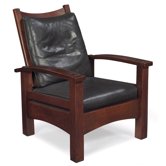 Appraisal: Gustav Stickley Morris chair desirable narrow bow-arm form with reverse-tapered