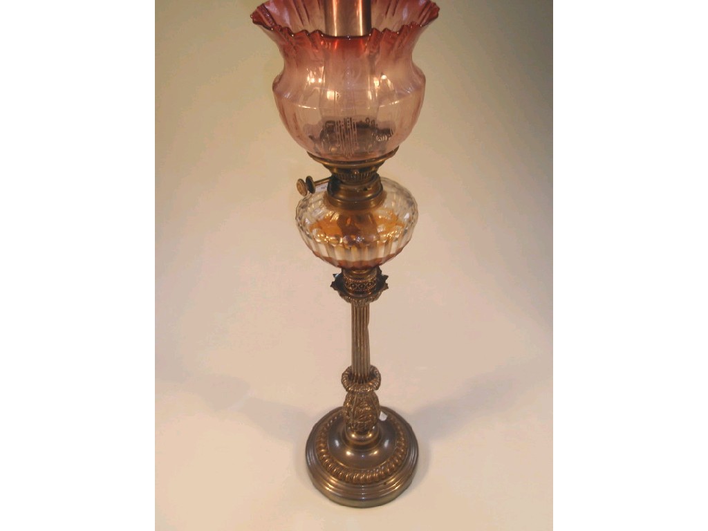 Appraisal: A thC electroplated oil lamp with a clear cut glass