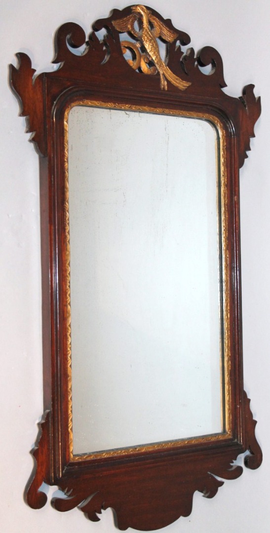 Appraisal: A thC stained mahogany pier glass with a heavily carved