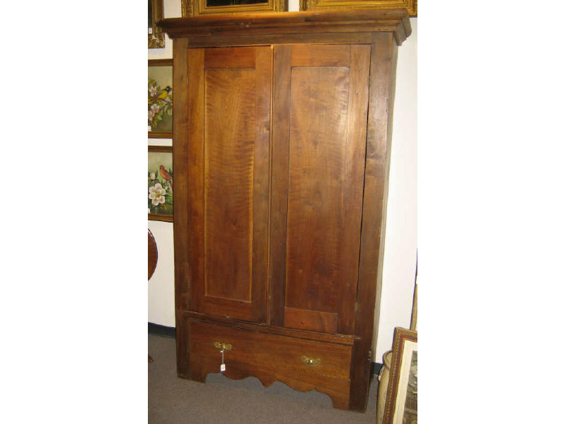 Appraisal: AMERICAN TH CENTURY WALNUT WARDROBE Molded cornice over the pair