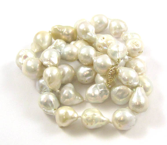 Appraisal: OPERA LENGTH BAROQUE PEARL NECKLACE inches in length strung with