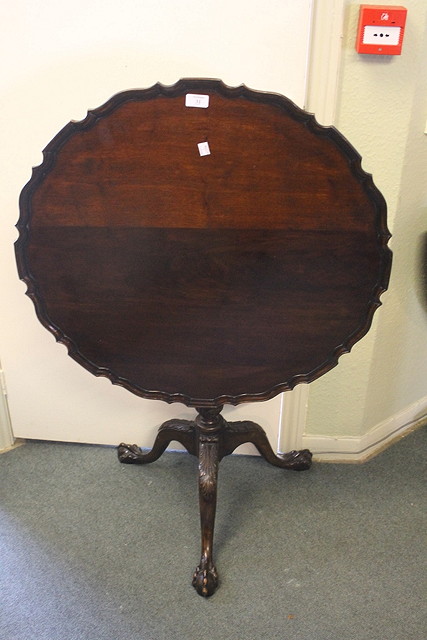 Appraisal: A CHIPPENDALE STYLE MAHOGANY TILT TOP TRIPOD TABLE the pie-crust